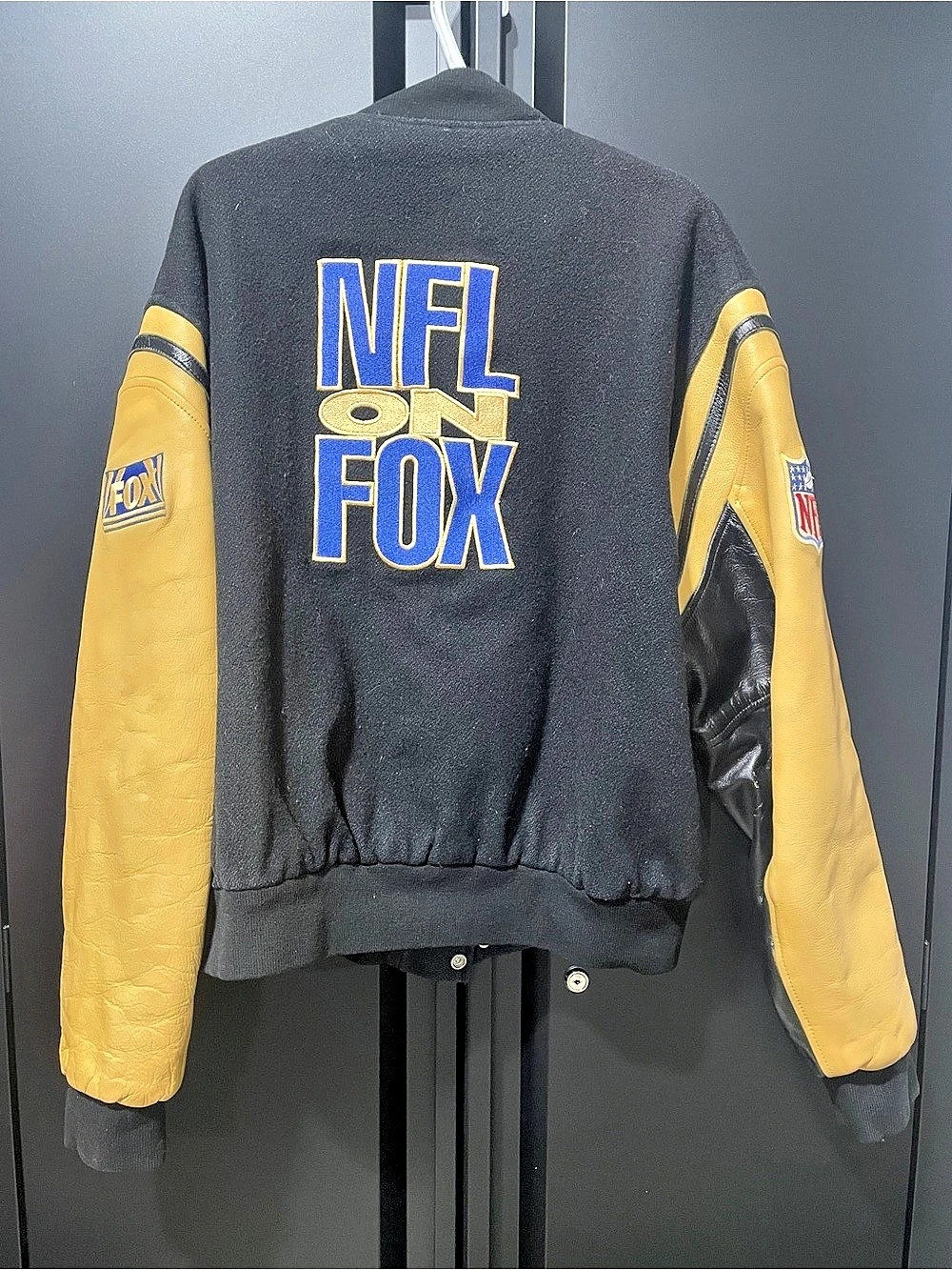 G.A.M.E. Sportswear, Ltd. NFL on FOX Varsity Jacket Black Yellow